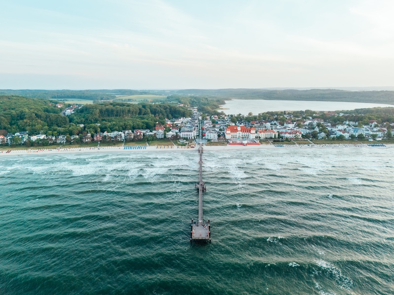 The pier at Binz on Rugen island in the Baltic sea, with waves washing up onto the beach