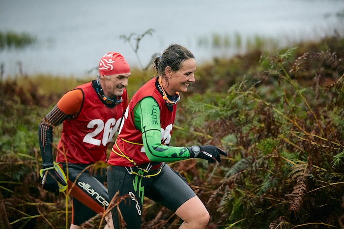 Two competitors wearing wetsuits at the Coniston swimrun in 2023 Two competitors wearing wetsuits at the Coniston swimrun in 2023