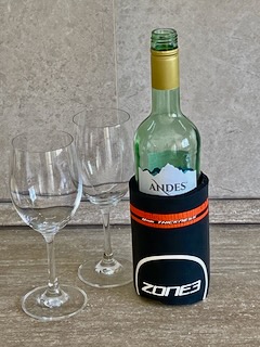 Zone 3 neoprene calf sleeve on a wine bottle