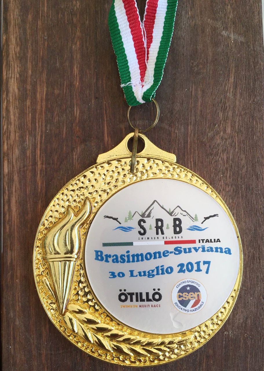 A finisher's medal from the SwimRun Bologna event in 2017