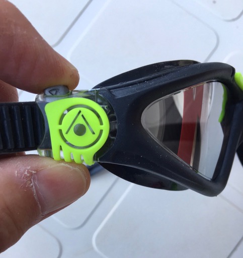 The size adjustment toggle on a pair of Aquasphere Swimrun goggles