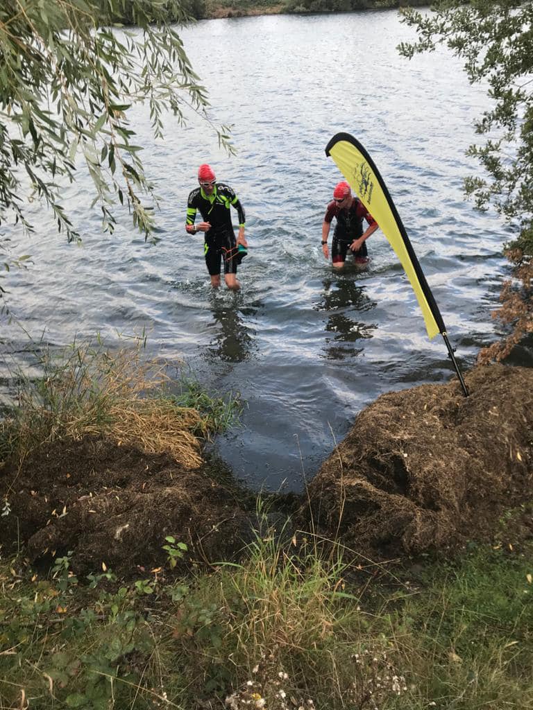 Swimrrunners exiting the water at Bewl Water Swimrun race