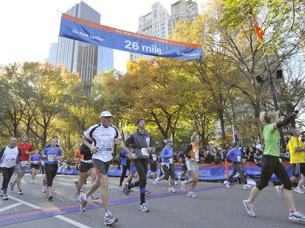 New York Marathon runners  running through Central Park, near the finish.