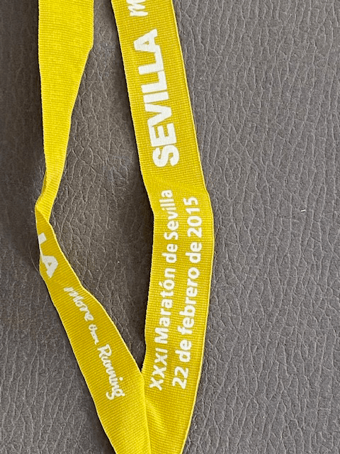 A Sevilla marathon finishr's medal ribbon