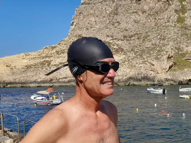 Swim hat goes over the sollawave earphones