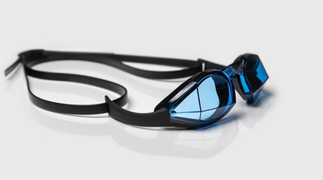 Blue tinted swimming goggles on a white background