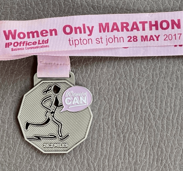 A Women Can marathon finisher's medal