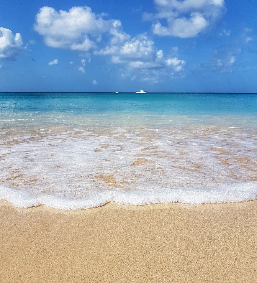 Blue sea on a Barbados beach with blue sky