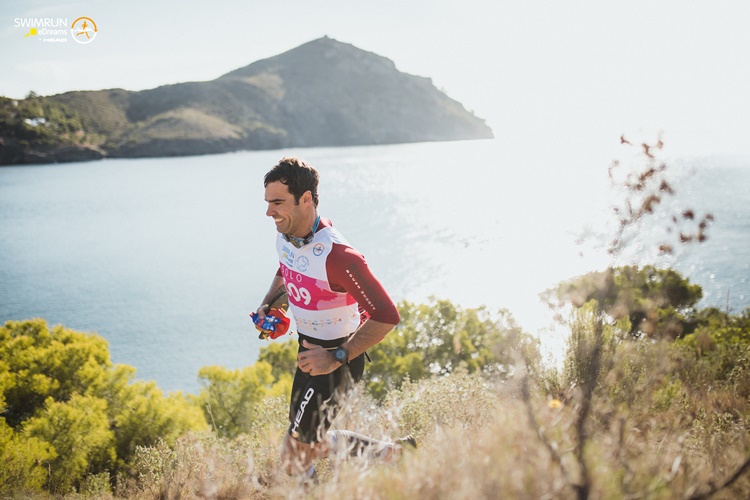 man running on cliff by sea man running on cliff by sea