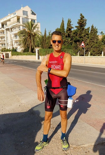 Richard getting ready to train for a long session, rubbing sun screen into his arms