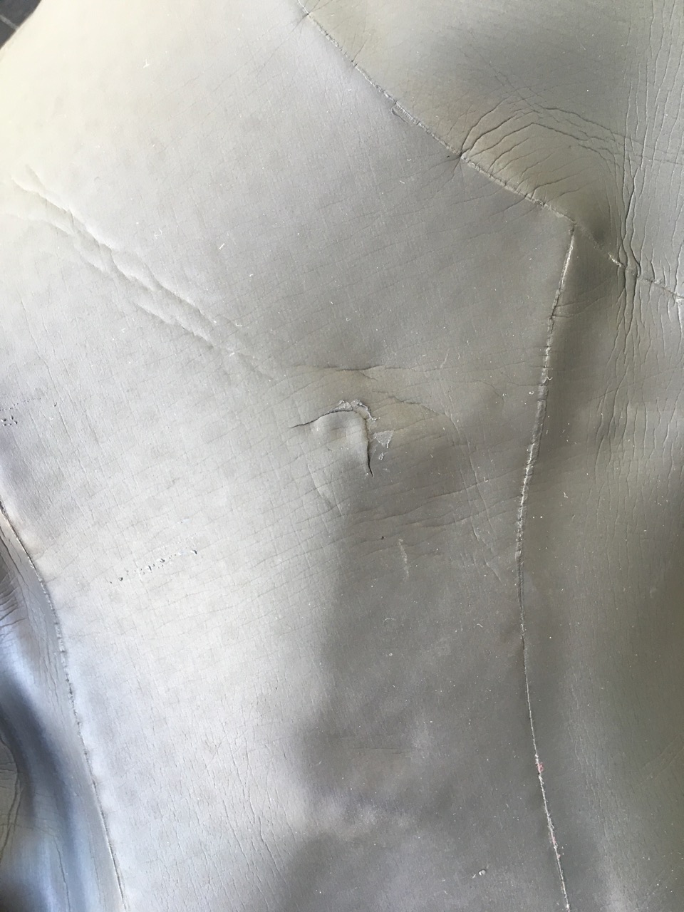 Close up of a repair to the neoprene of a Swim Run Wetsuit